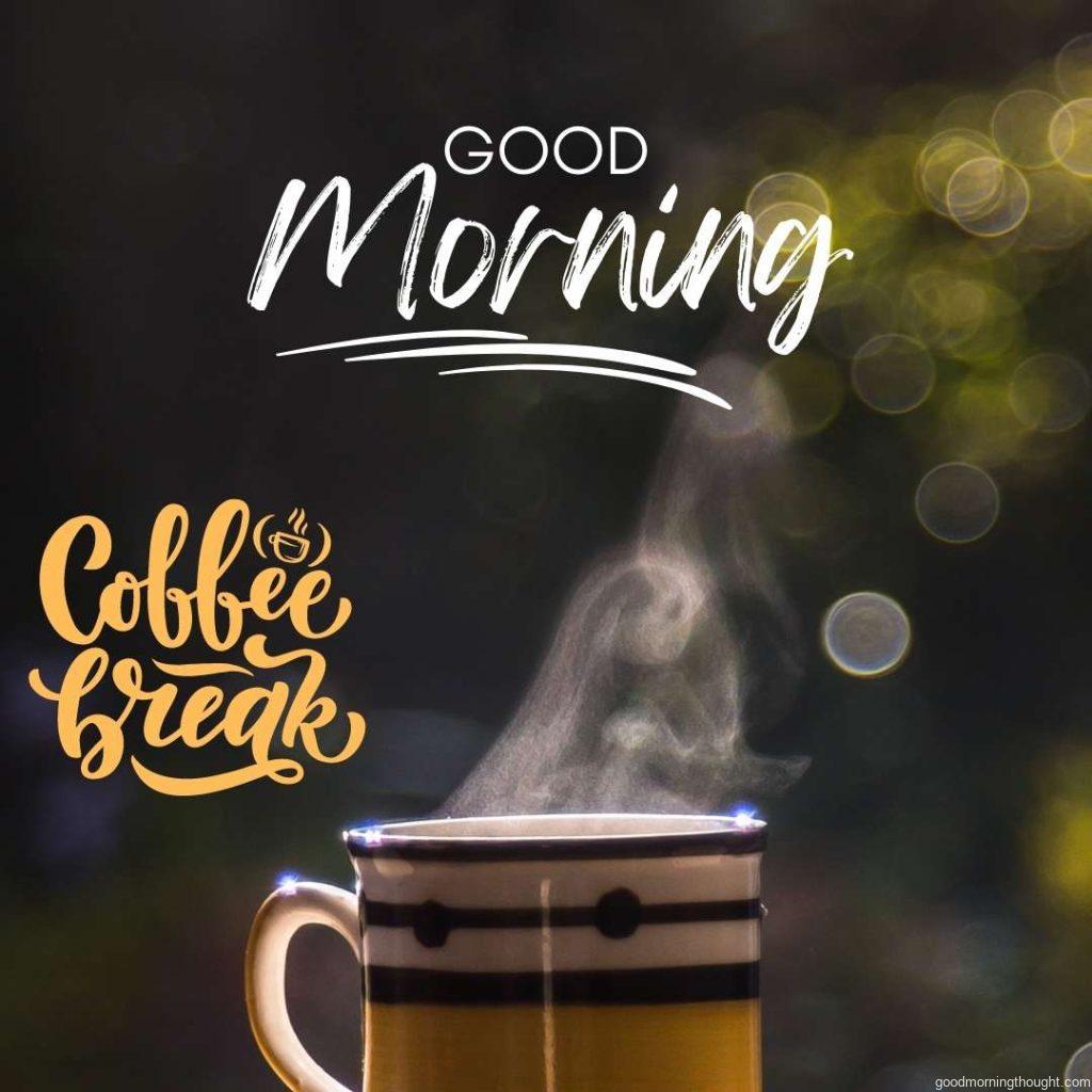 A cup with morning hot coffee with dark green background and _coffee break_ message