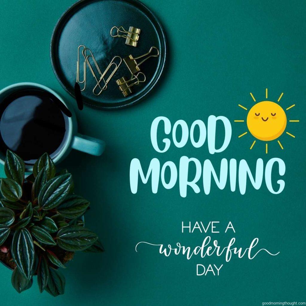 Cup of coffee on flatlay modern office table with good morning and have a wonderful day message written on it