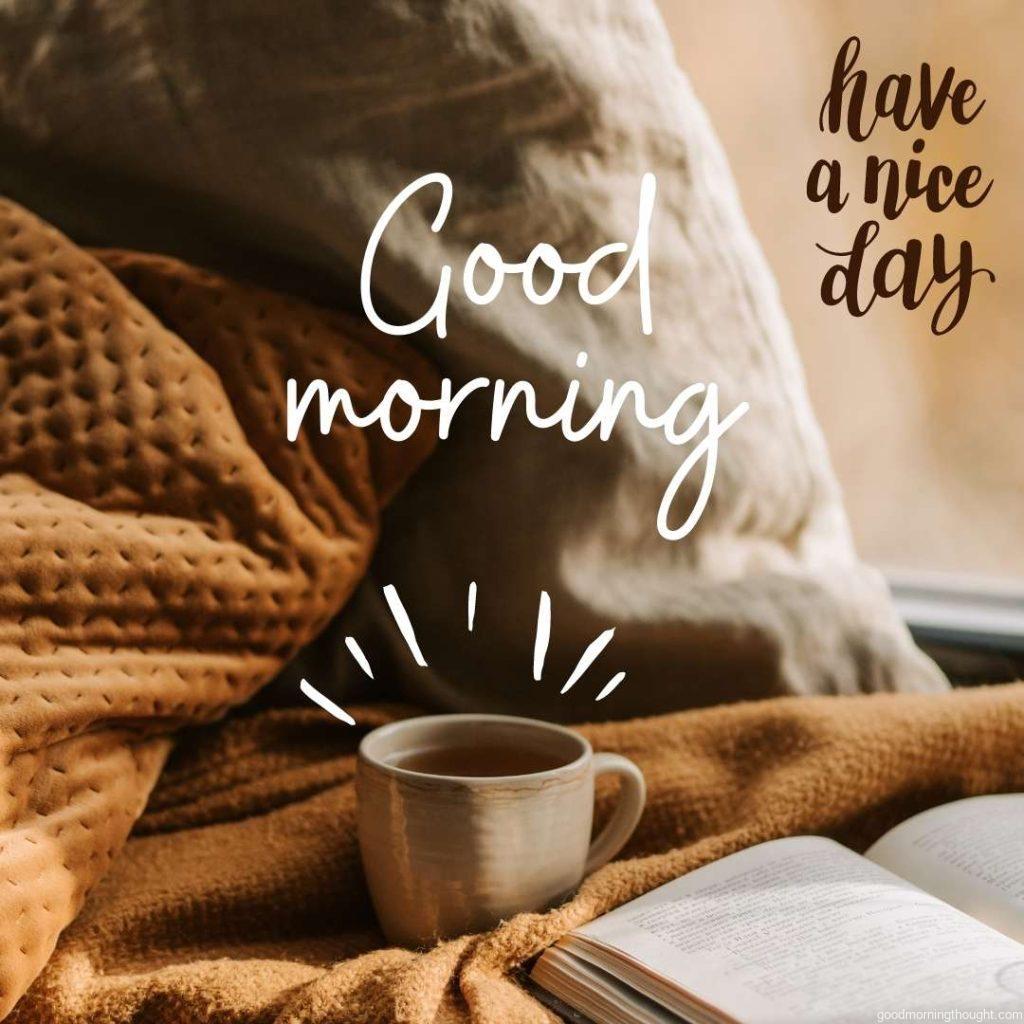 Cup of hot coffee with book and good morning message