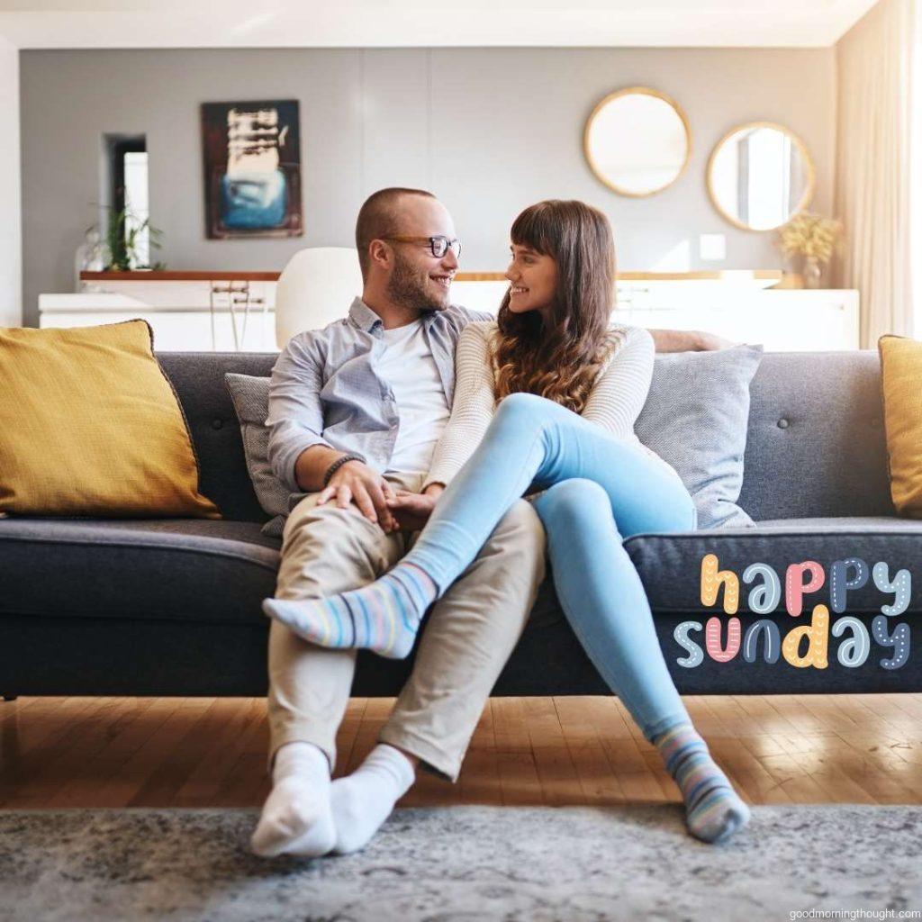 Happy young couple relaxing on sofa. Good Morning Sunday Image