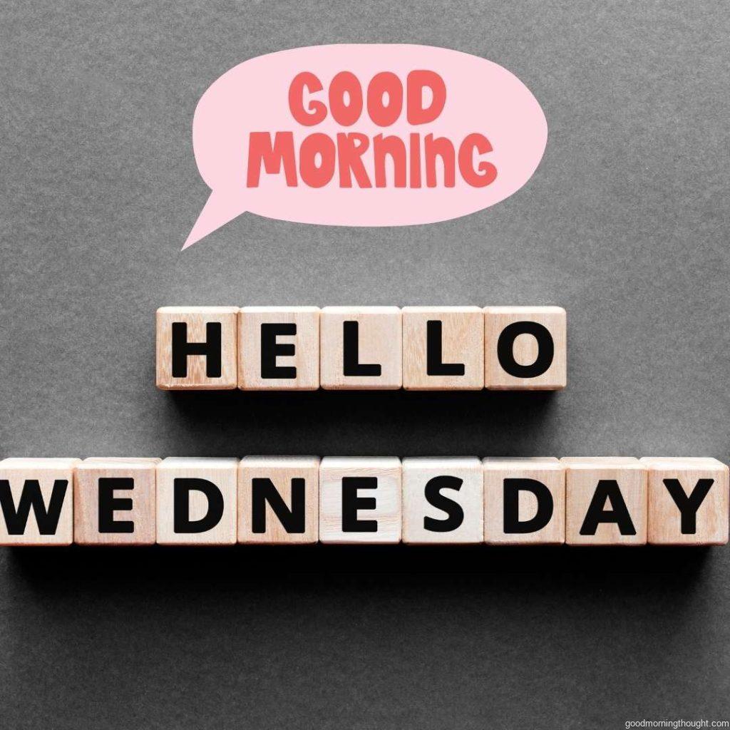 Hello Wednesday words from wooden block with Good Morning Wednesday message