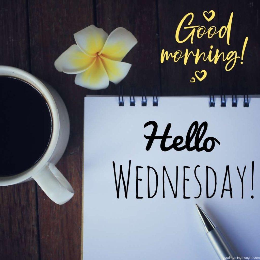 Hello wednesday greeting with cup of morning coffee, text greeting on note book