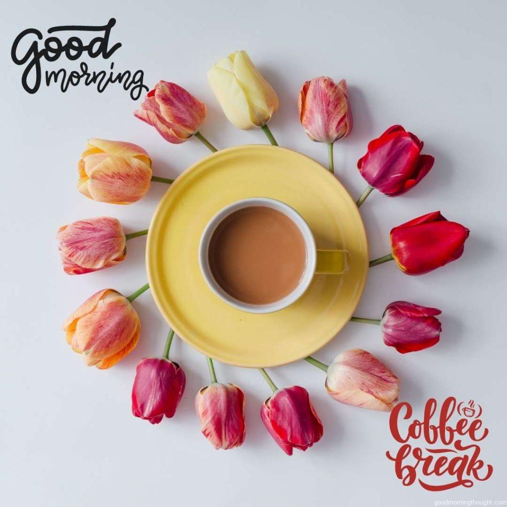 Morning coffee with creative arrangement of tulip flowers on bright background