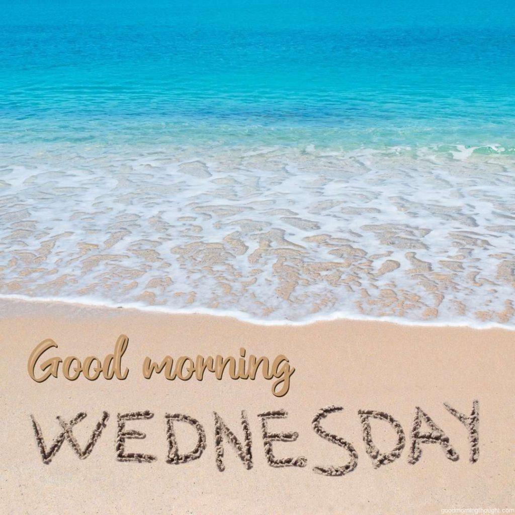 Wednesday written on tropical beach. Good Morning Wednesday Image