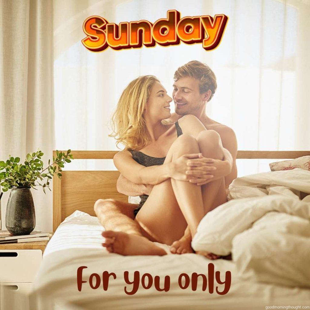 Young beautiful couple sharing intimate moment in bed at Sunday Morning. Good Morning Sunday Image