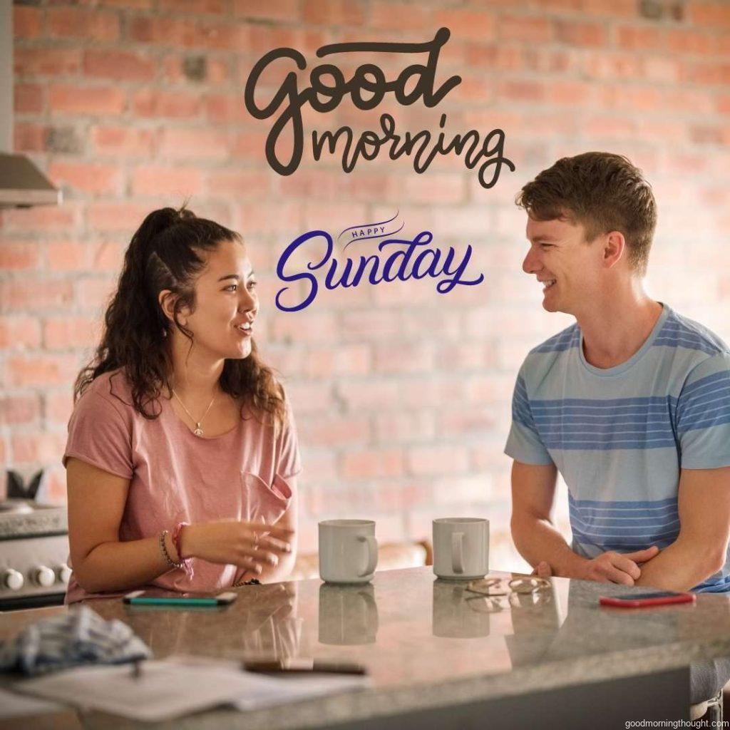 Young couple talking in the kitchen while having morning coffee at home