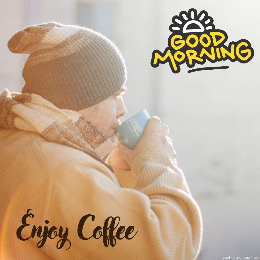 man drinking coffee at morning with woolen cap and sweater