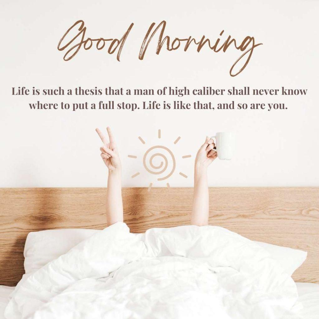 hands of young girl in bed with coffee mug in hand