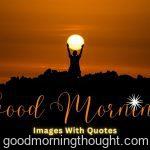 morning sunrise view with man standing in front of sun and hands up