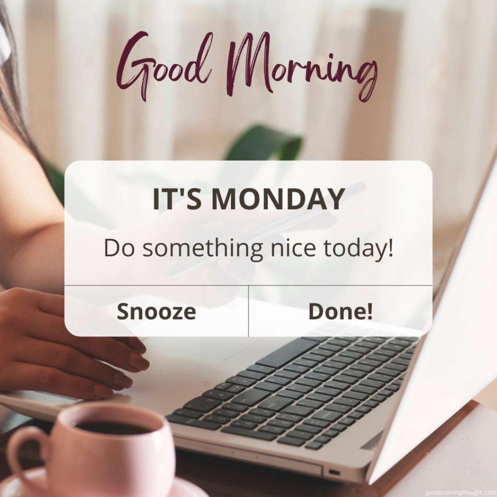 A woman hands a computer with coffee in the background, on which _Good morning, happy Monday_ text is written