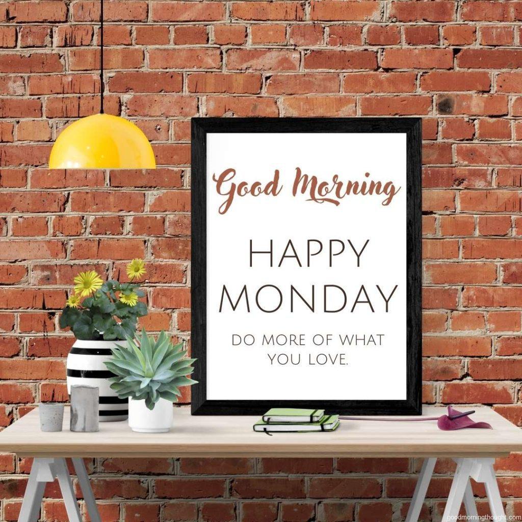 Blank frame on a brick wall, and _Good morning, happy Monday_ text is written on it