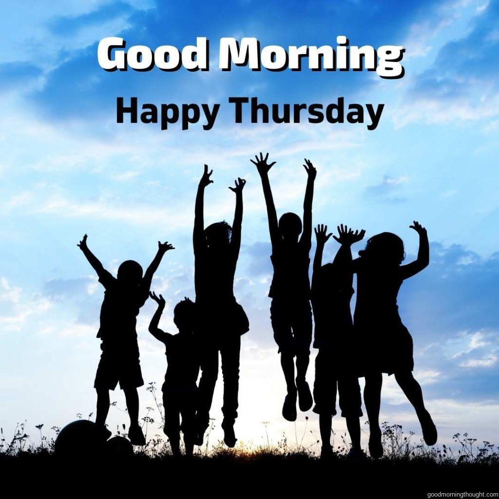 Children are playing outdoors with hands up and saying good morning and happy Thursday