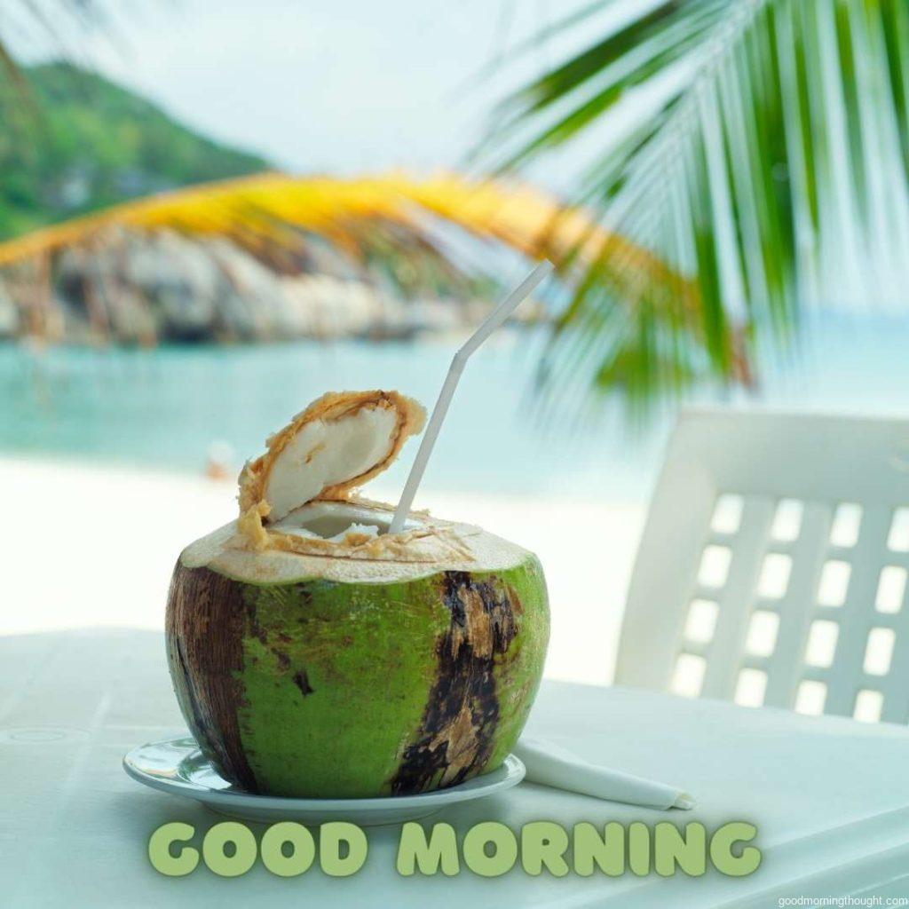 Coconut, beach cafe, on a table with a blurry background of sea and island Good morning, beach images