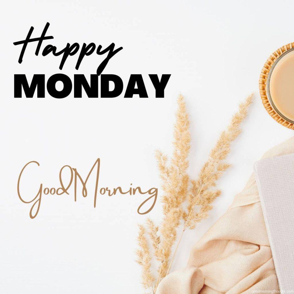 Flat-lay, top-view, cosy home office desk Beige blanket, cup of coffee, paper notebook, and dry flowers on a white table _Good morning, happy Monday_ text is written on it