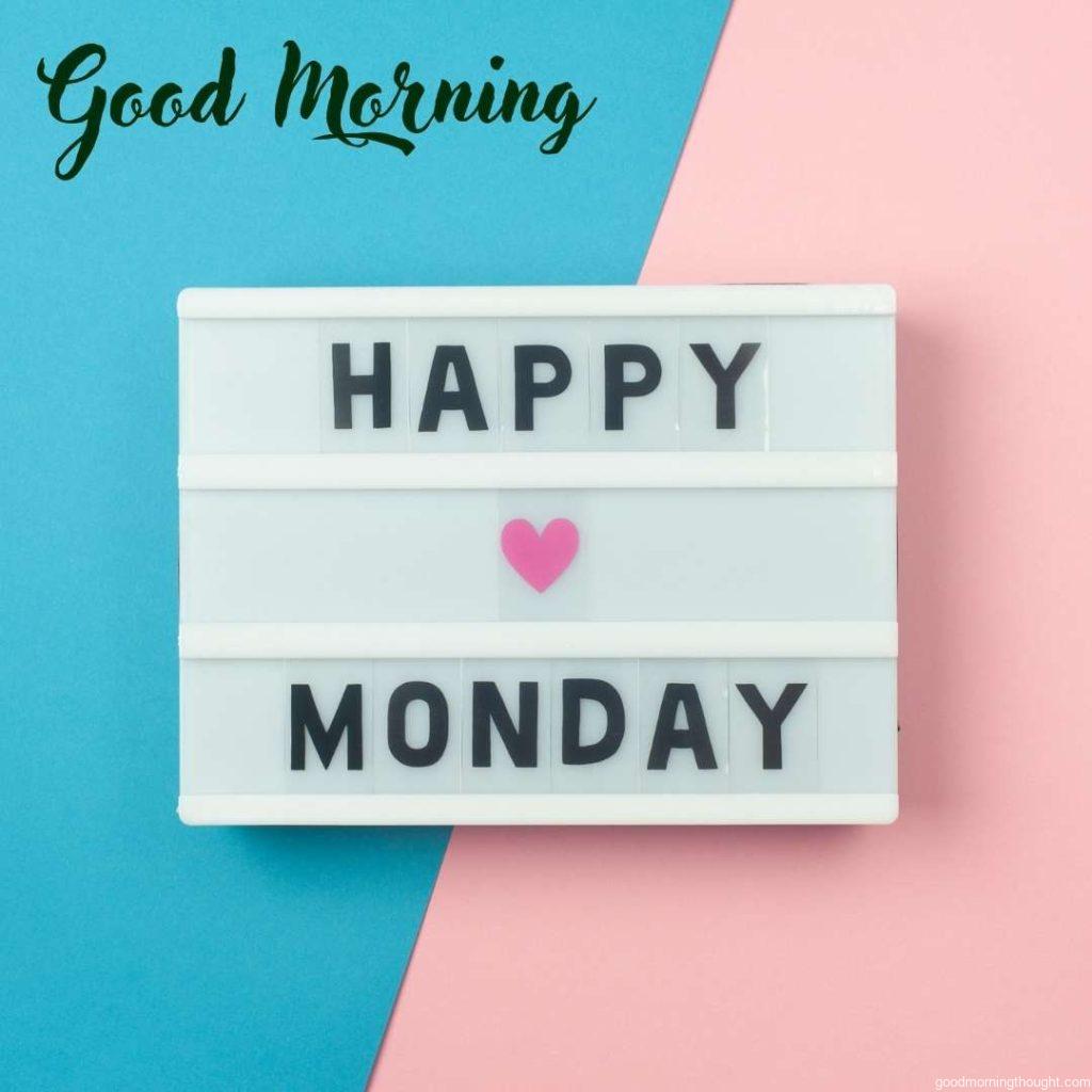 Happy Monday, Good Morning—text on display lightbox on blue and pink background