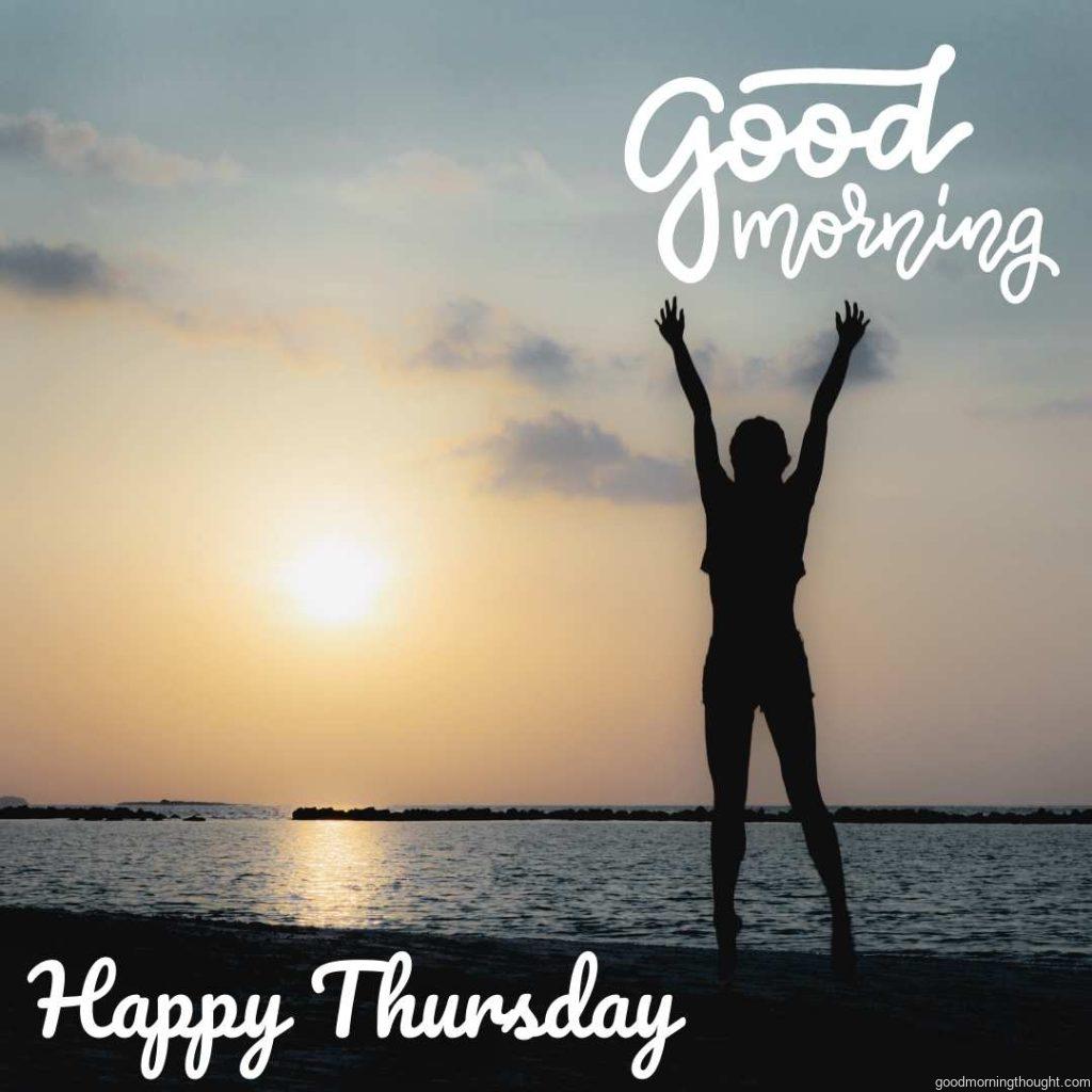 Man standing on the beach with hands up with a _Good Morning, Happy Thursday_ text