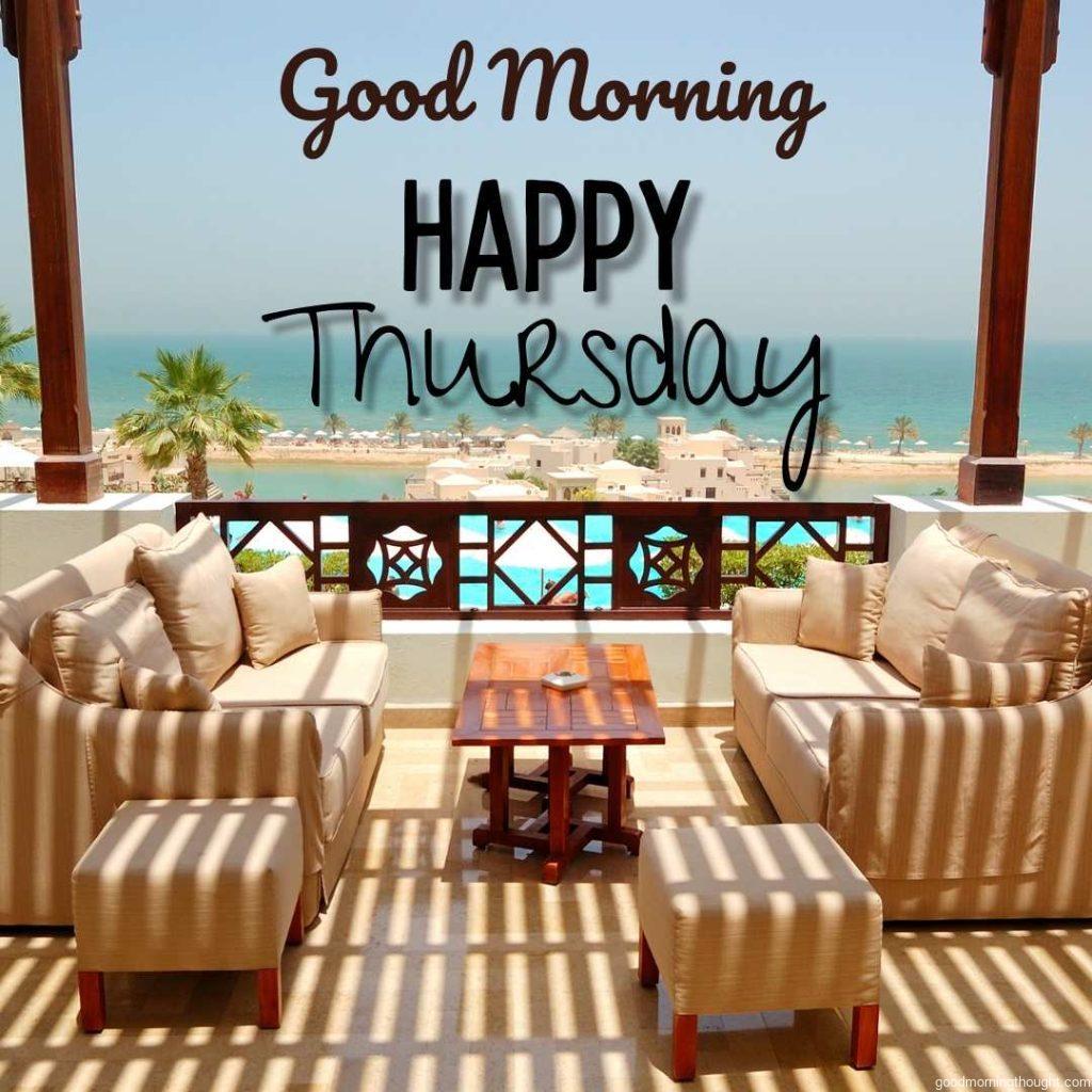 Sea view terrace at a luxury hotel in Ras Al Khaimah, UAE, with a _Good Morning, Happy Thursday_ text message