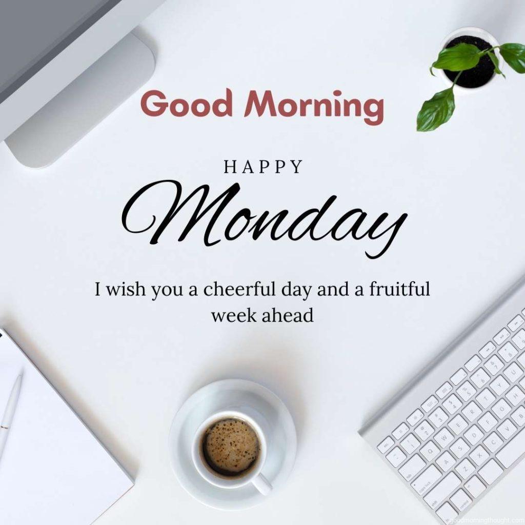 Top View of Modern Technology Working Place on a White Office Desk with a Large Desktop Computer, Coffee Mug, Keyboard, and Mouse, Green Flower Notepad, and Pen. Happy Monday image