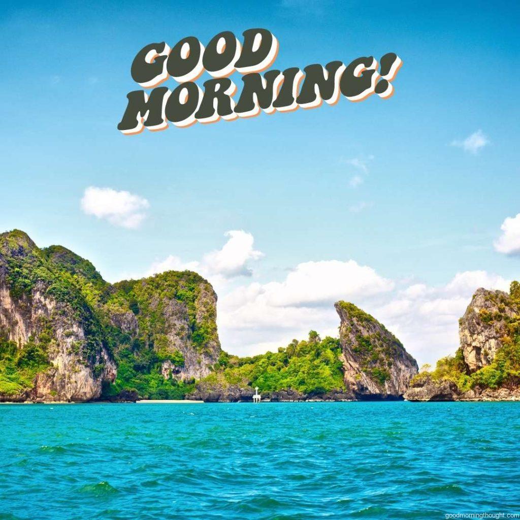 morning view of a tall cliff with trees at the Andaman Sea, Thailand. Good morning beach images