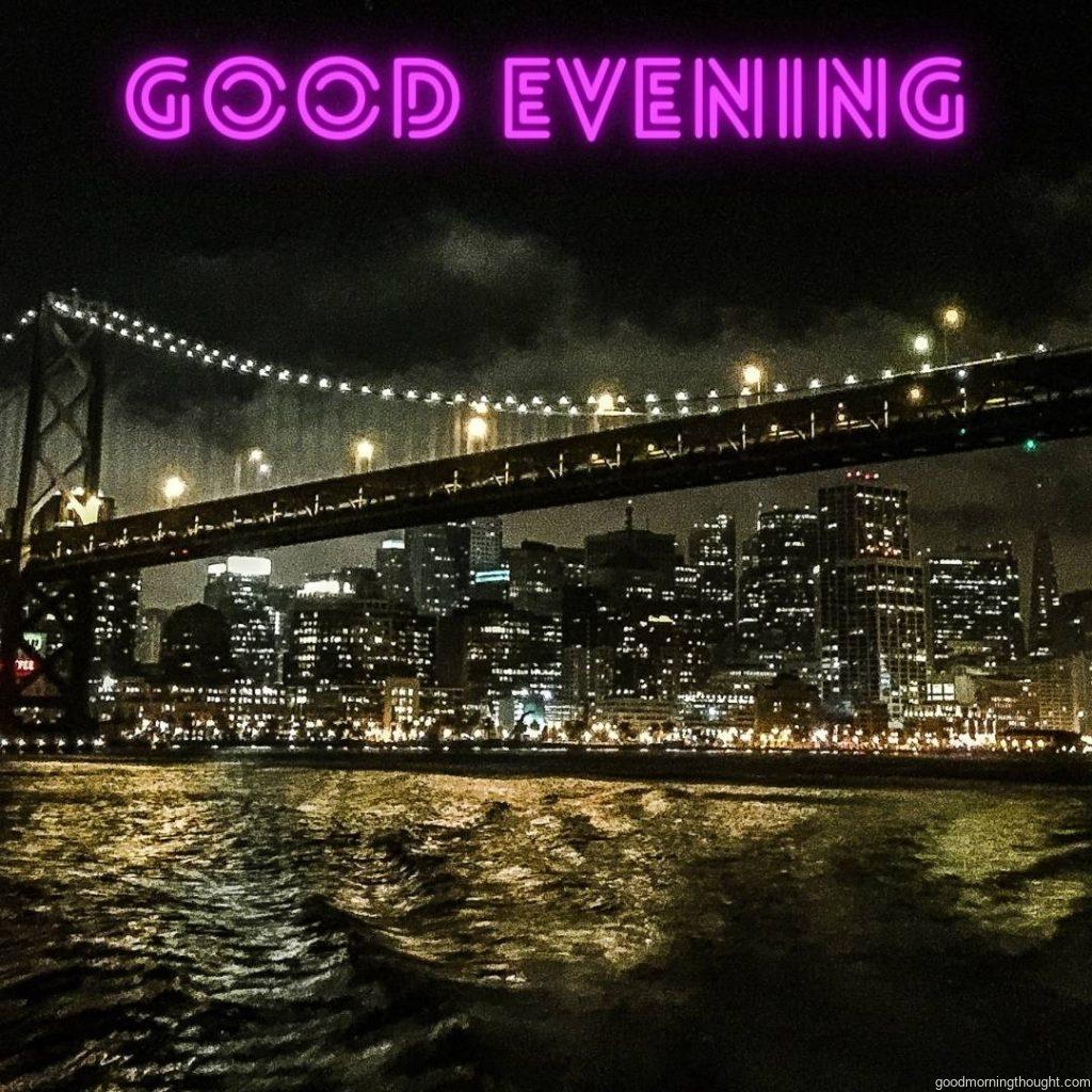 A beautiful cityscape shot with the city of San Francisco as the painted background illuminated by many lights with the _good evening_ text written on it