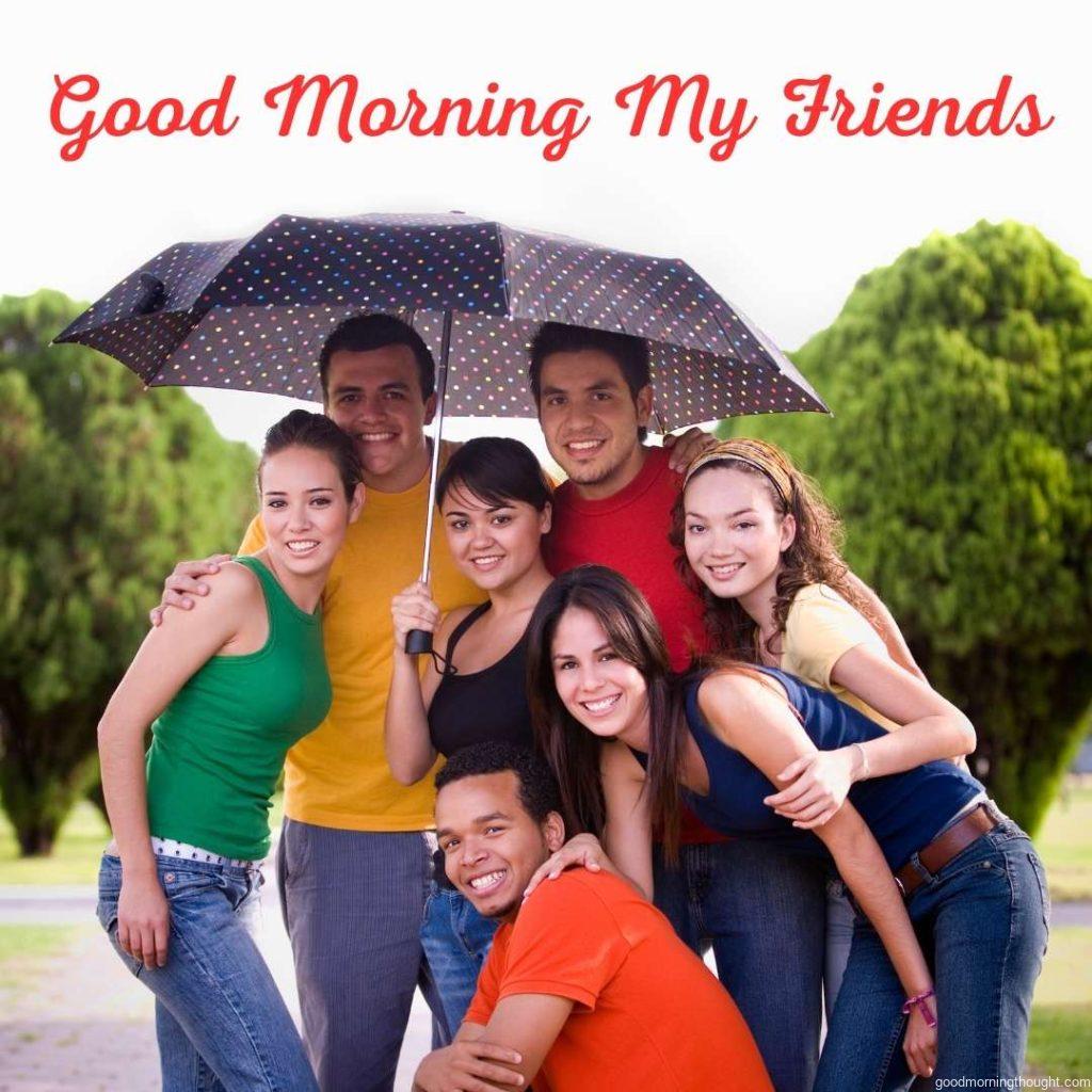 A mixed group of friends under an umbrella Good morning text