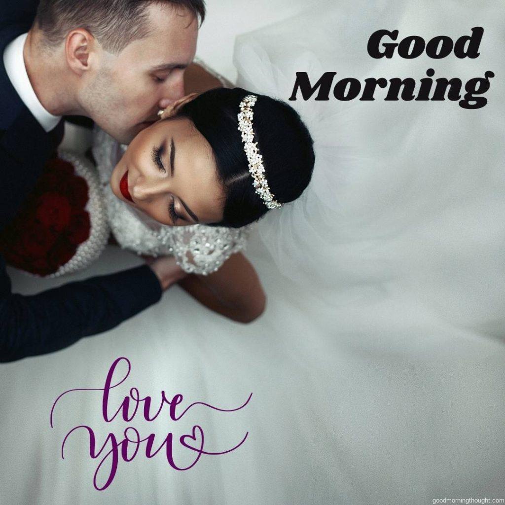 A romantic groom kissing a brunette bride on the neck, shot from above. Love Romantic Kiss Good Morning Images