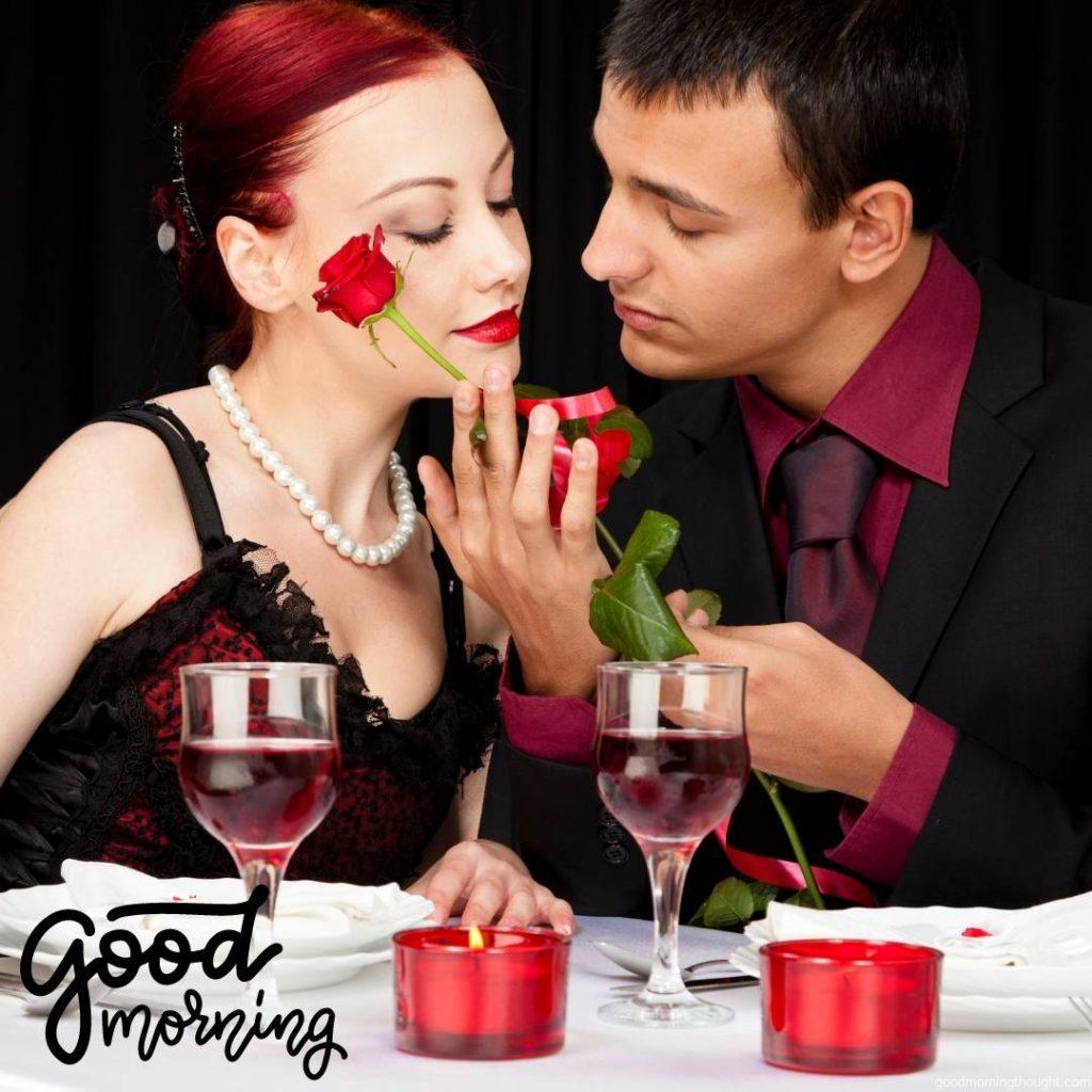 A young couple having a romantic dinner in a restaurant setting on a black background with good morning text