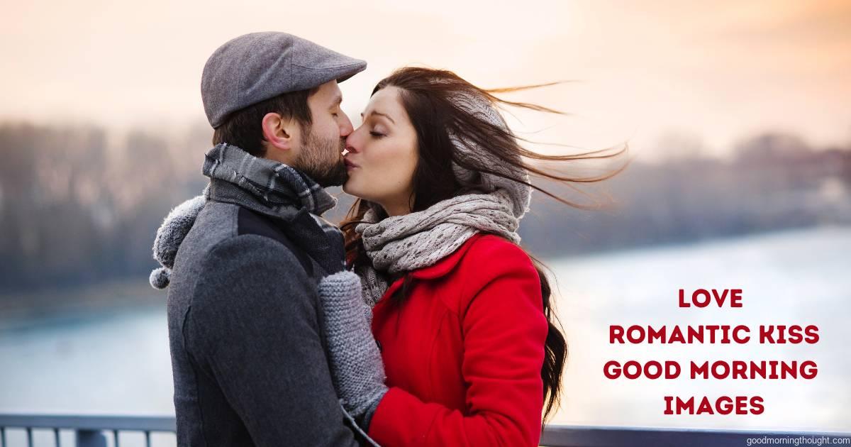 A young couple kissing by the river in winter weather is a romantic kiss good morning image