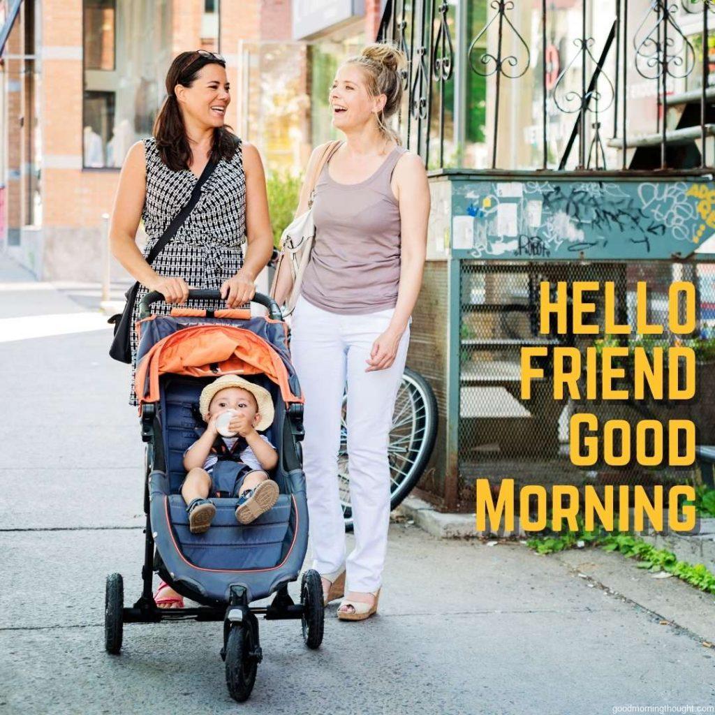 An urban mom with a stroller meets a friend on the street. Square. Good morning text