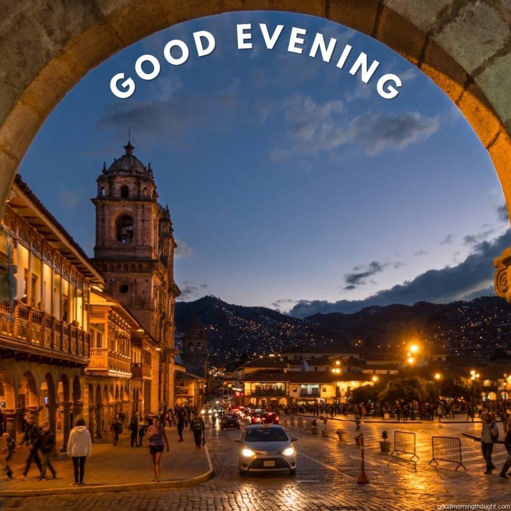 Cusco city in the evening, taken inside a stone archway of the colonial historical centre. Cuzco, Peru, the _good evening_ text