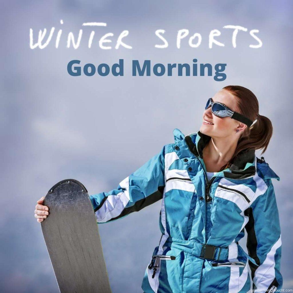 Cute young snowboarder girl having fun outdoors, cloudy sky, ski resort, spending winter vacation in the mountains, _Good morning_ text