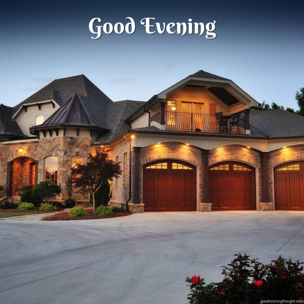 Front of a luxury home photographed at evening, the _good evening_ text