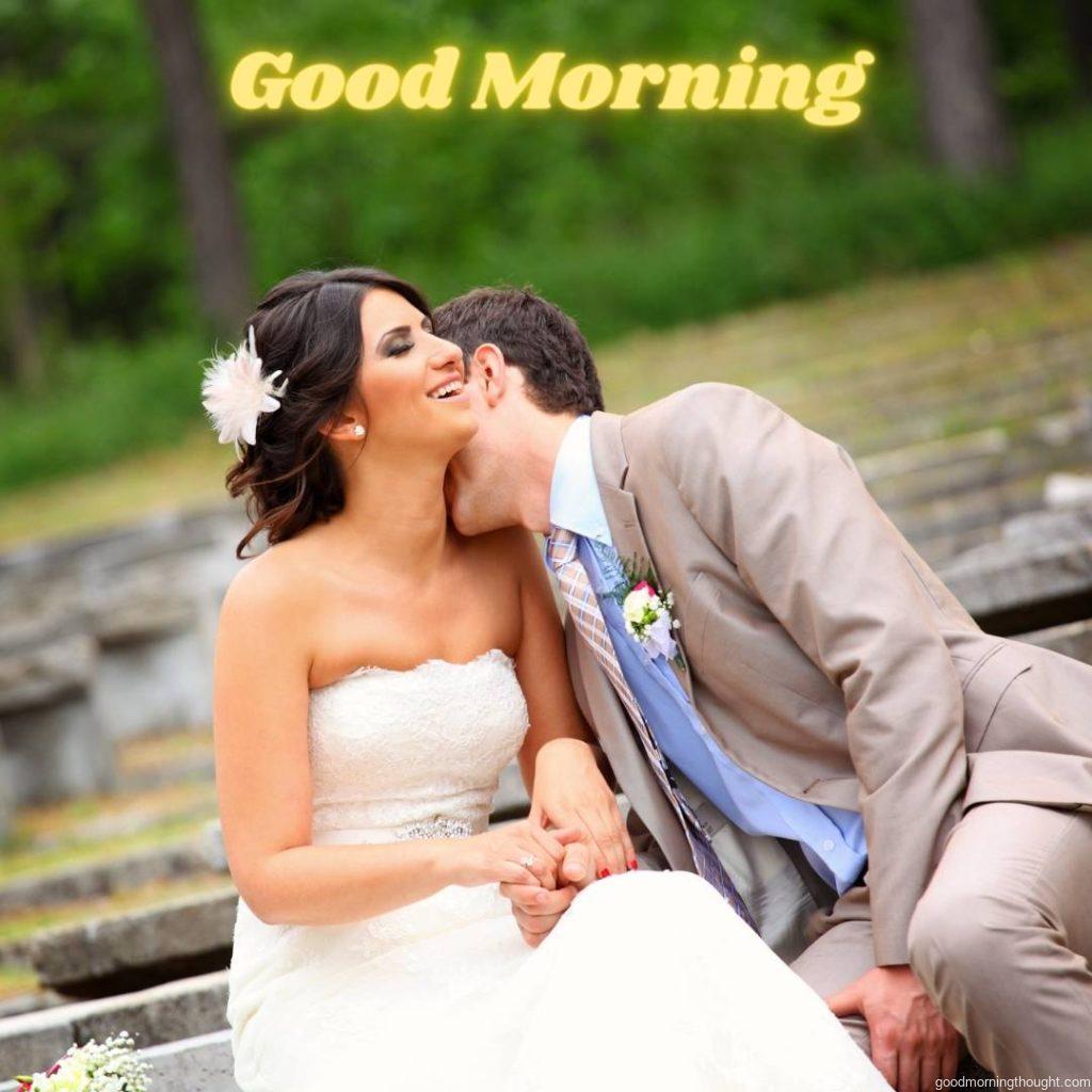 Groom kissing his bride on the neck, romantic kiss, good morning image