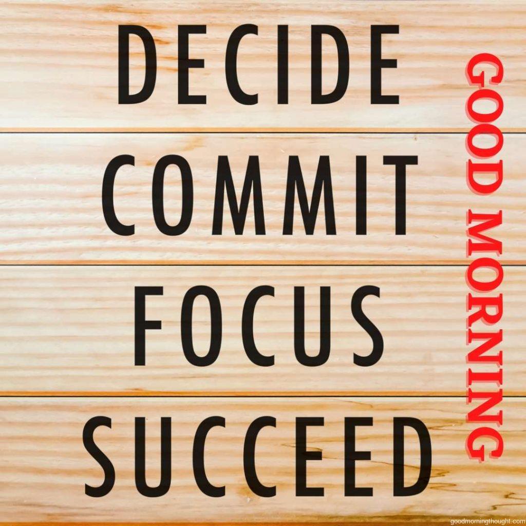 Motivational and inspirational quotes_ _Decide, commit, focus, succeed with a wooden background and good morning text