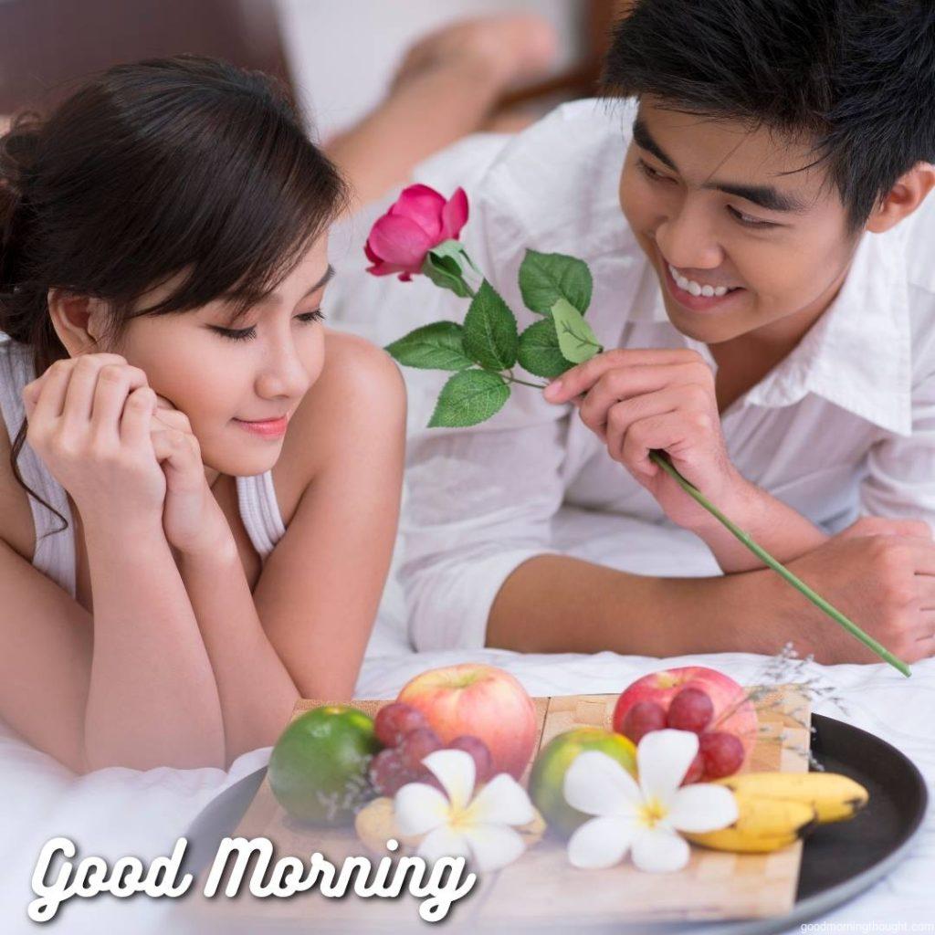 Portrait of a young Asian couple having breakfast in bed, Love Romantic Kiss Good Morning Image