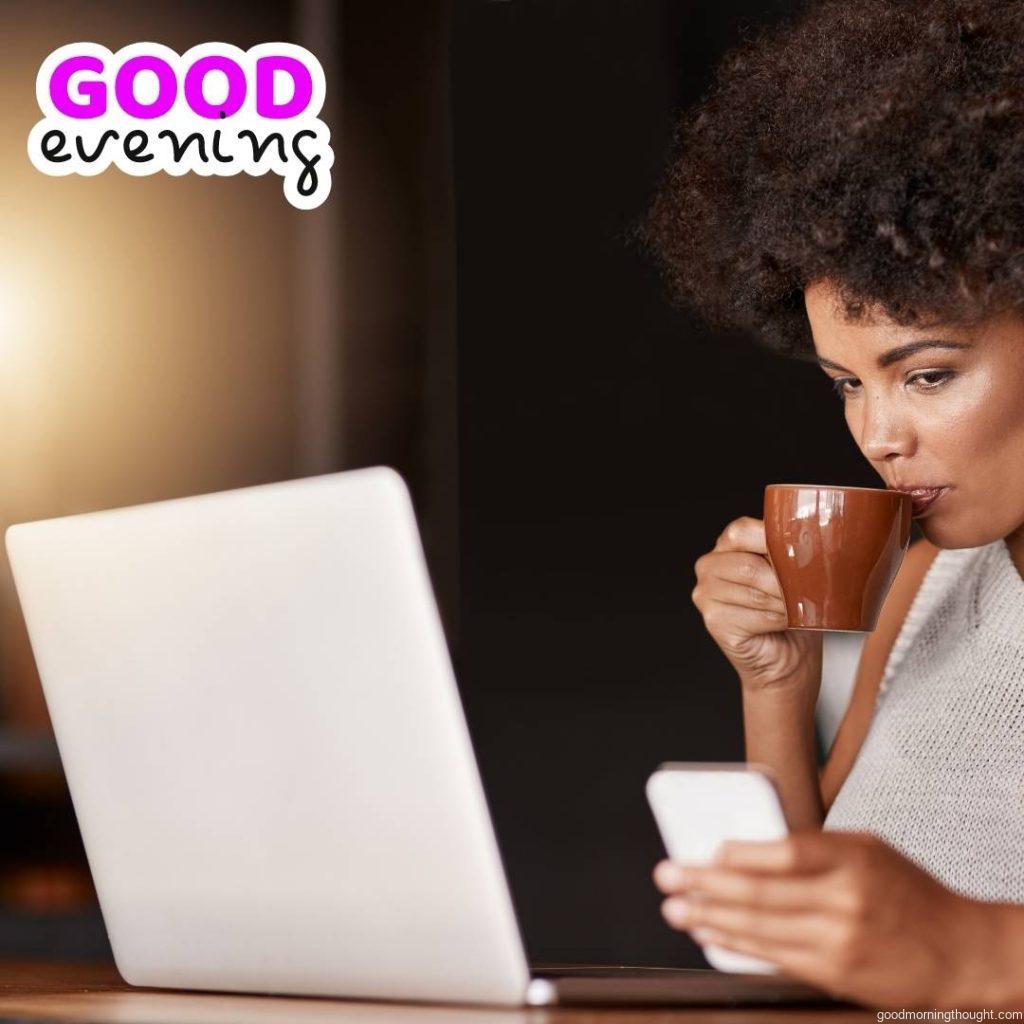 Shot of a young business owner using a laptop while sitting in her cafe in the evening hours, Good Evening Images