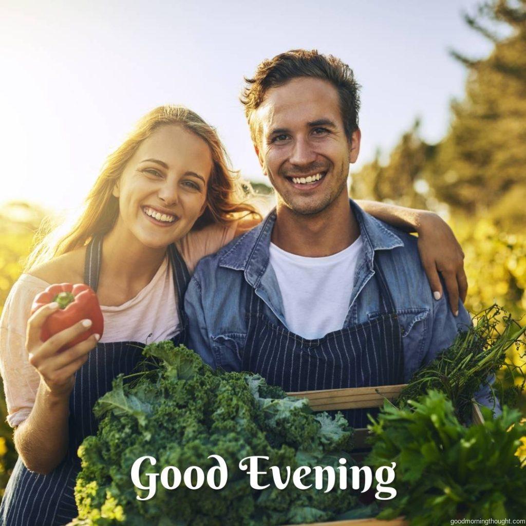 Shot of a young man and woman working together on a farm in the evening hours, _good evening_ text