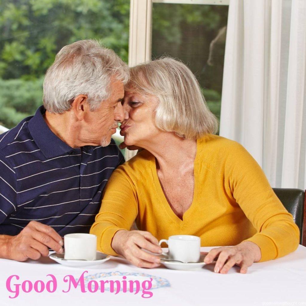 Two senior people in love kiss each other in a retirement home. Love Romantic Kiss Good Morning Image