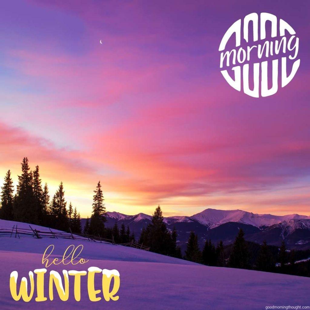 Winter morning landscape The sun rises behind trees and lights up the clouds. Wooden fence in a snowy field. Twilight. Purple colours. Romantic mood, _Good morning_ text