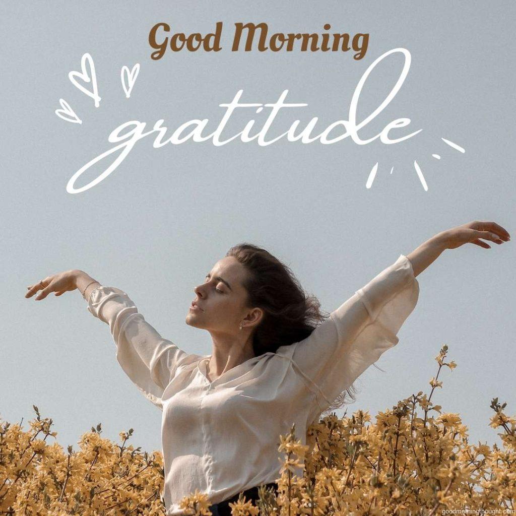 Woman in a flower field in the morning. Inspirational image