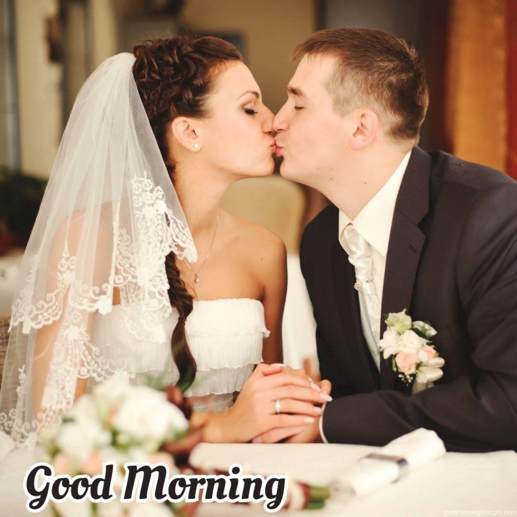 Young groom and bride. Wedding couple kissing. Love Romantic Kiss Good Morning Image