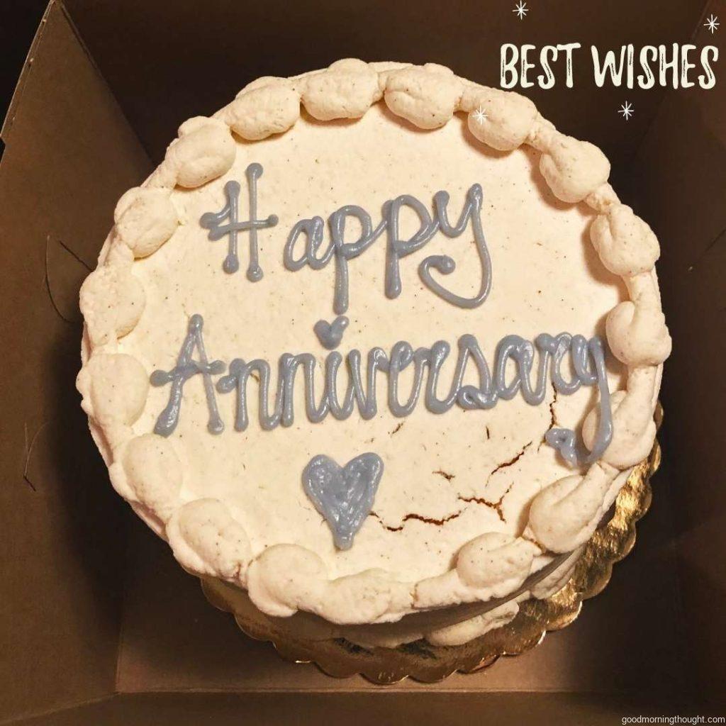 A Happy Anniversary cake in a box with a small heart