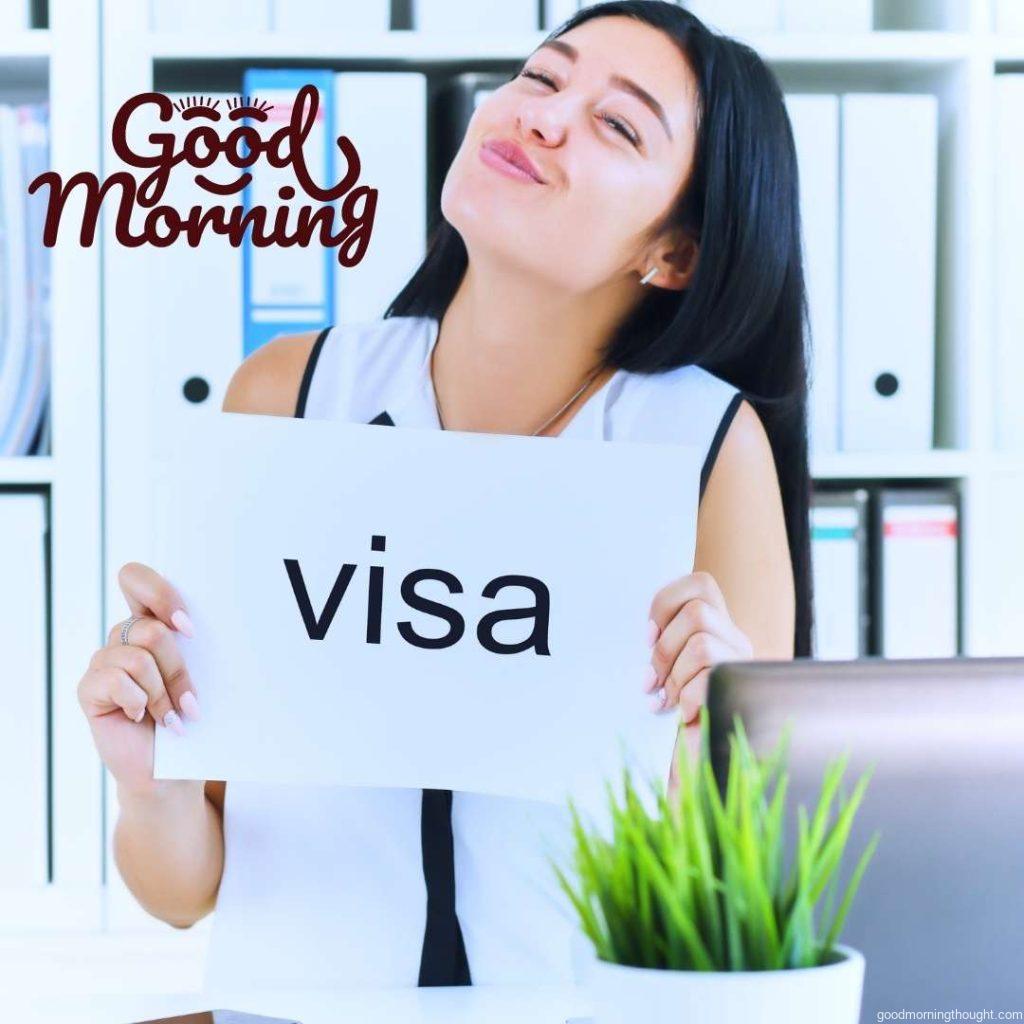 A young girl received a work visa in the United States. Happy girl holding a poster with the inscription Visa. Happy Good Morning Images