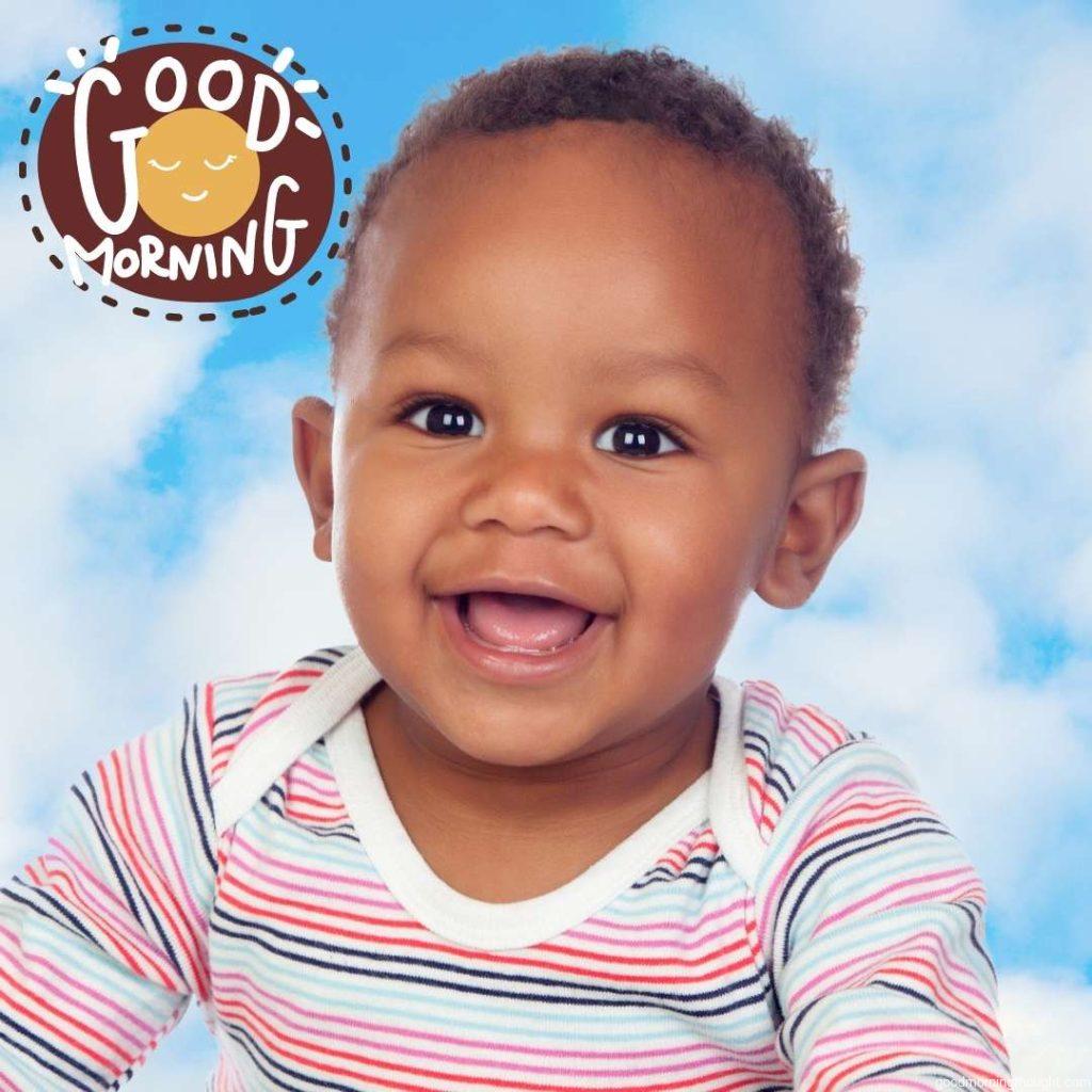 Adorable African American Baby Smiling with a Blue Sky Background, Good Morning Text