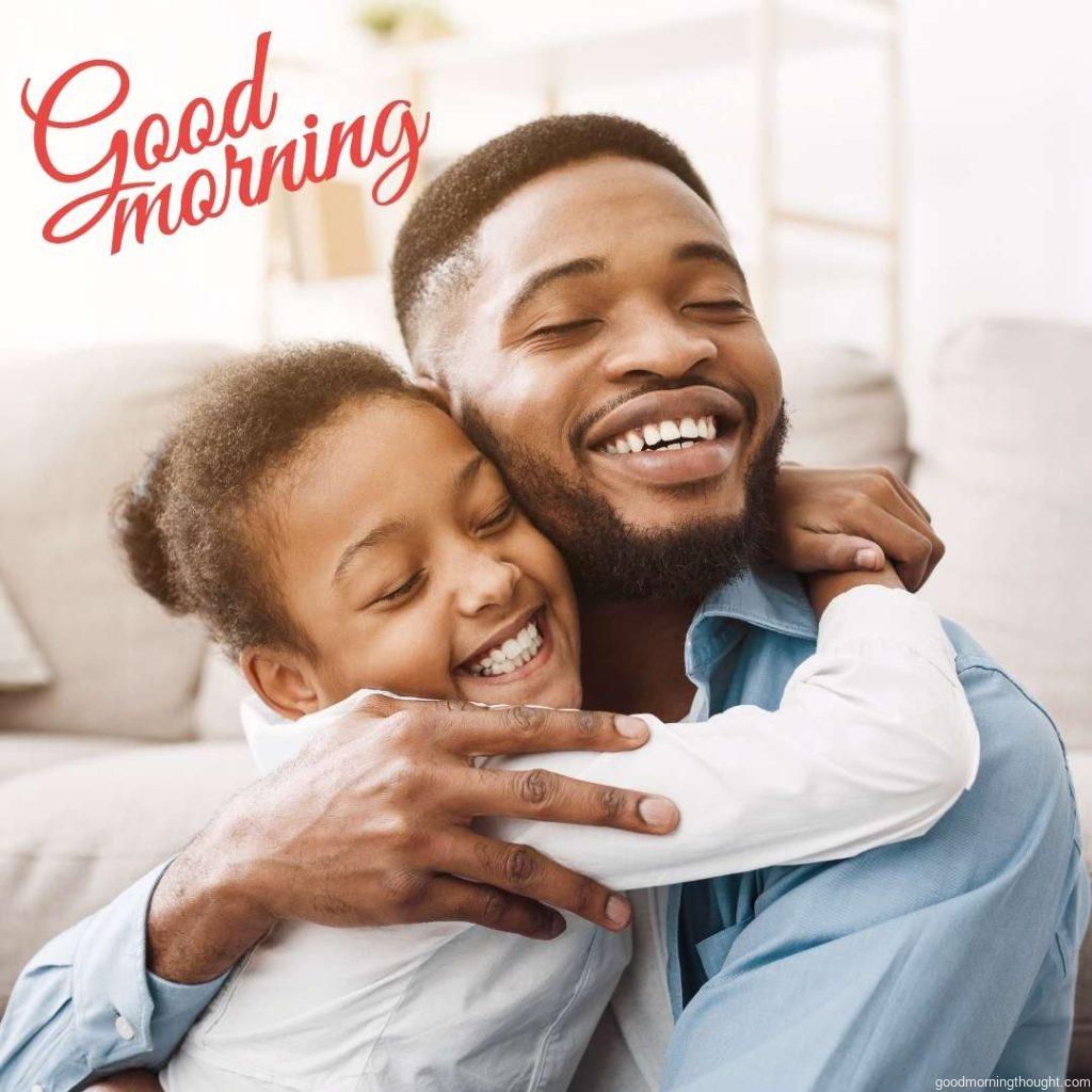 African-American daughter hugging father with love and tenderness at home, Good Morning Text