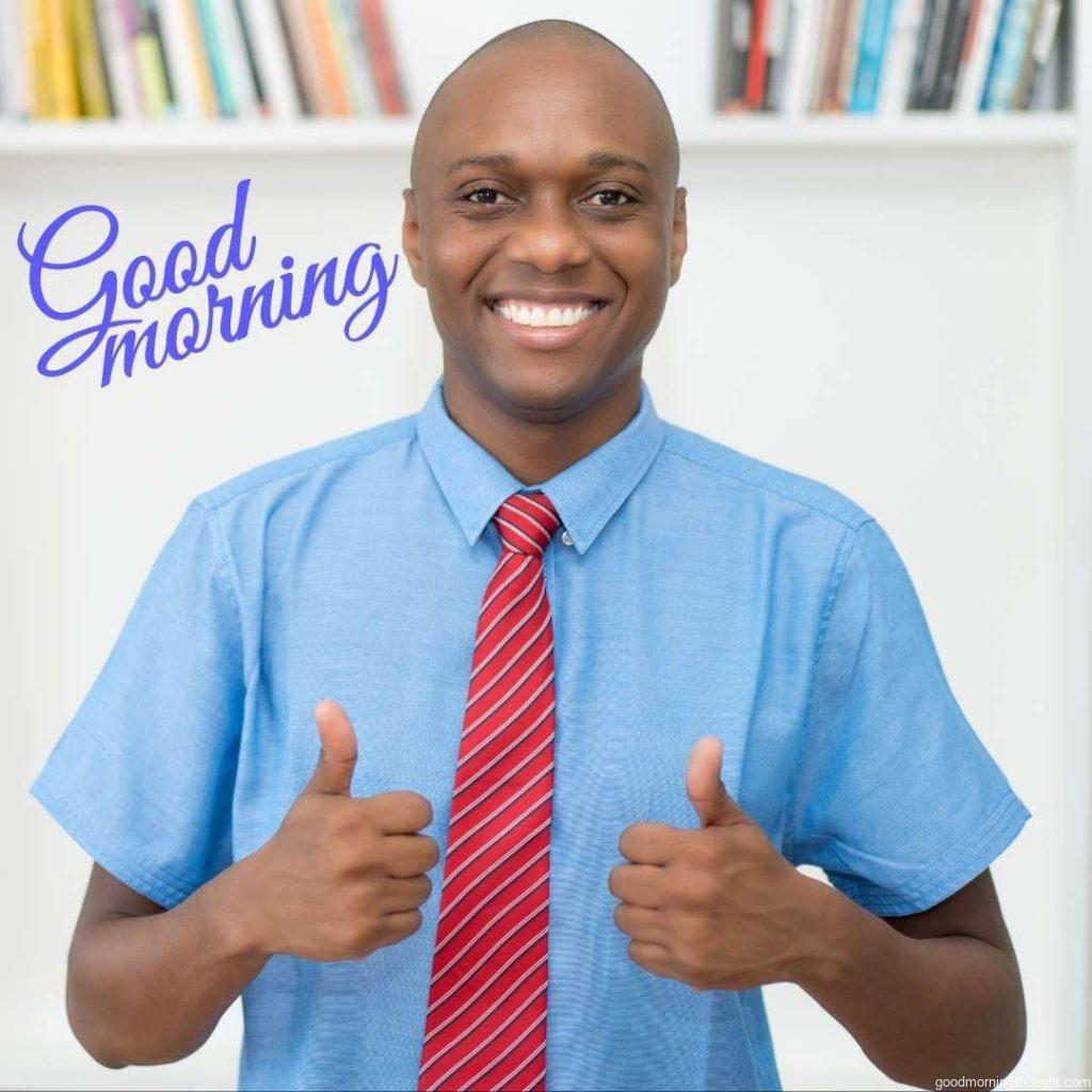 African American mature businessman showing thumbs up at office, Good Morning Text