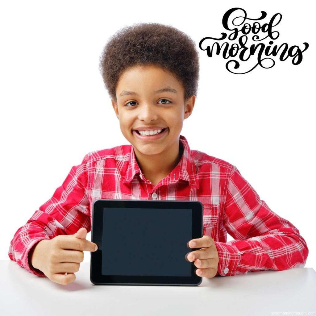 African American schoolboy or teenager smiling and pointing, black, blank tablet, African American Good Morning Images