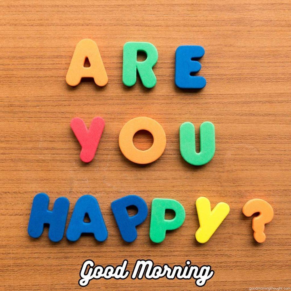 Are you happy with the colorful words on the wooden background_ Word Good Morning