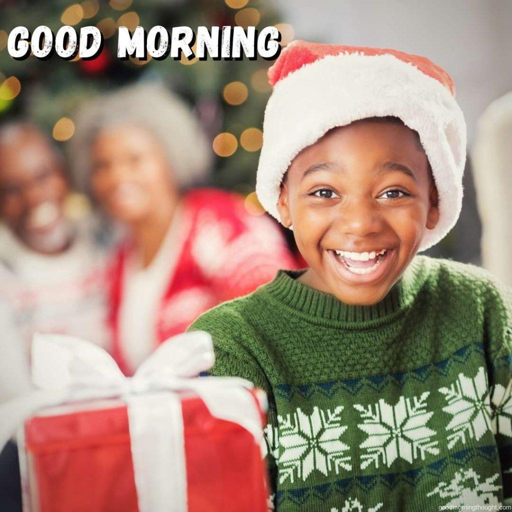 Excited African American boy on Christmas morning. African American Good Morning Images