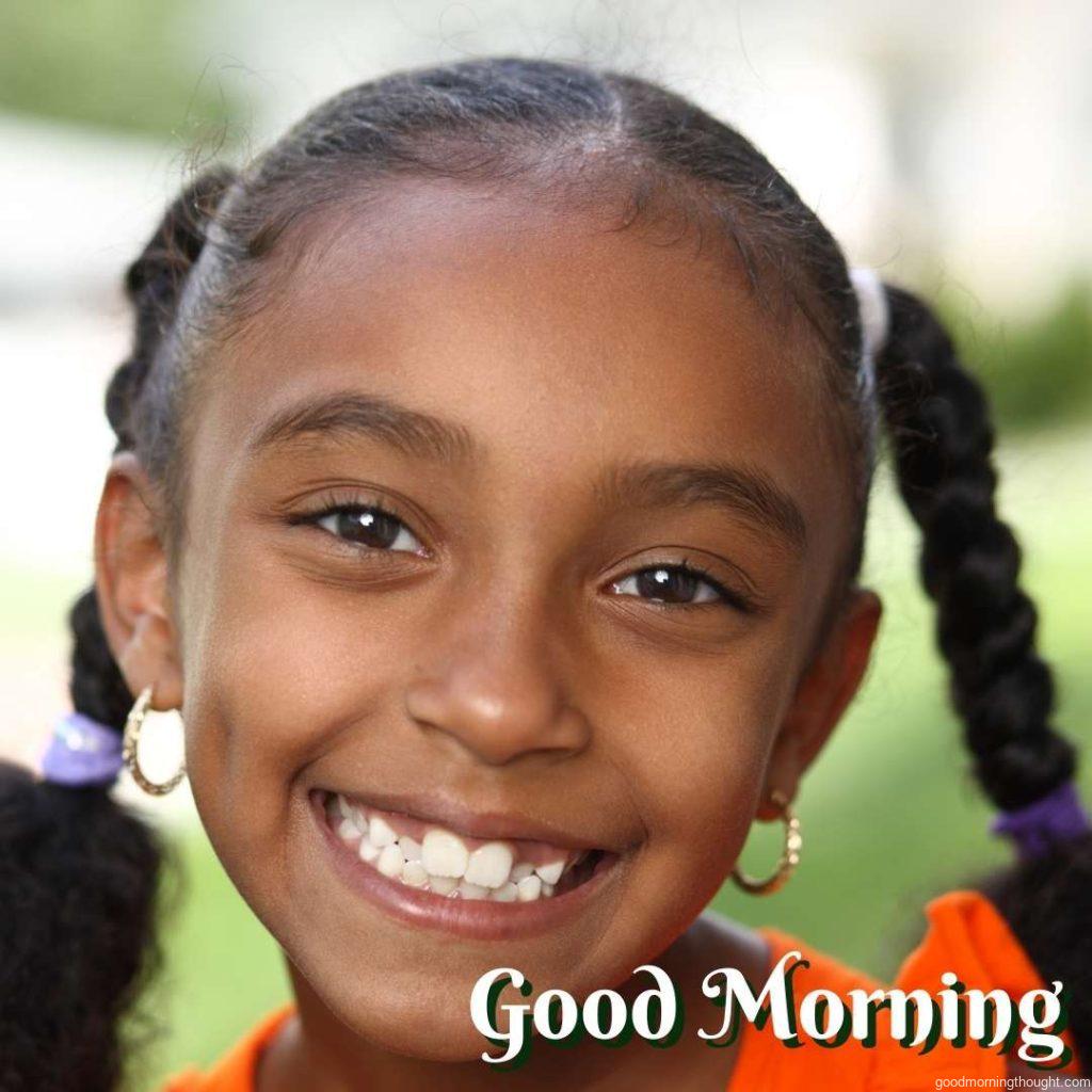 Happy little girl. _Good Morning_ text